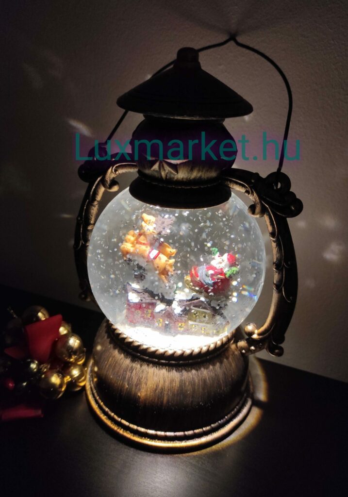 Karácsonyi LED lámpás zenél világít hóesést imitál 21 cm mikulás rénszarvas motívummal